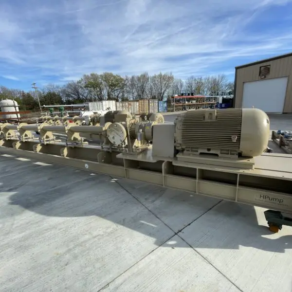 Industrial pump system on concrete surface.