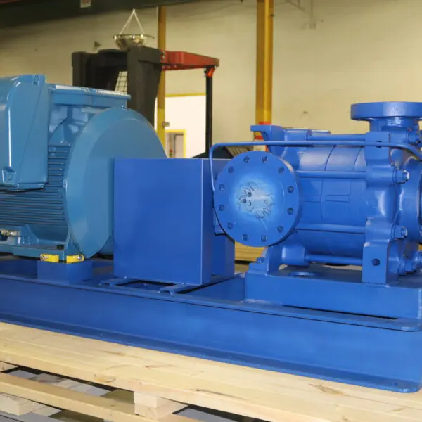 Blue electric motor and pump on platform.