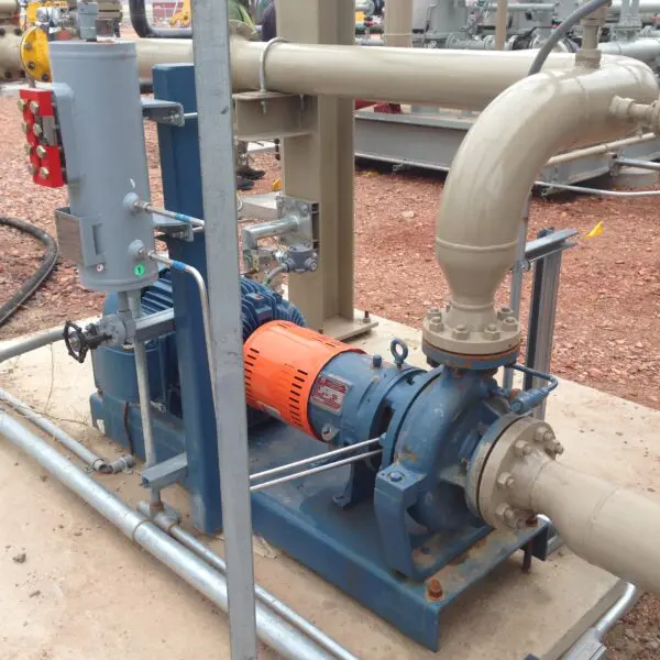 Industrial pump and motor assembly on site.