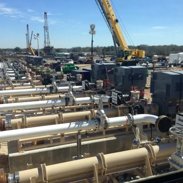 Industrial site with pipelines and machinery.